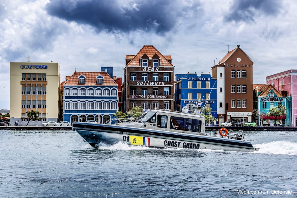 A coast guard vessel in front of the waterfront of Willemstad, Curaçao