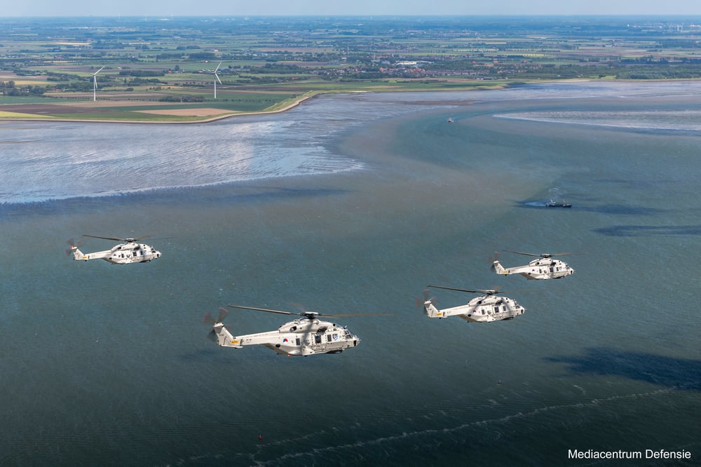Helicopters of the Dutch armed forces flying over the coast