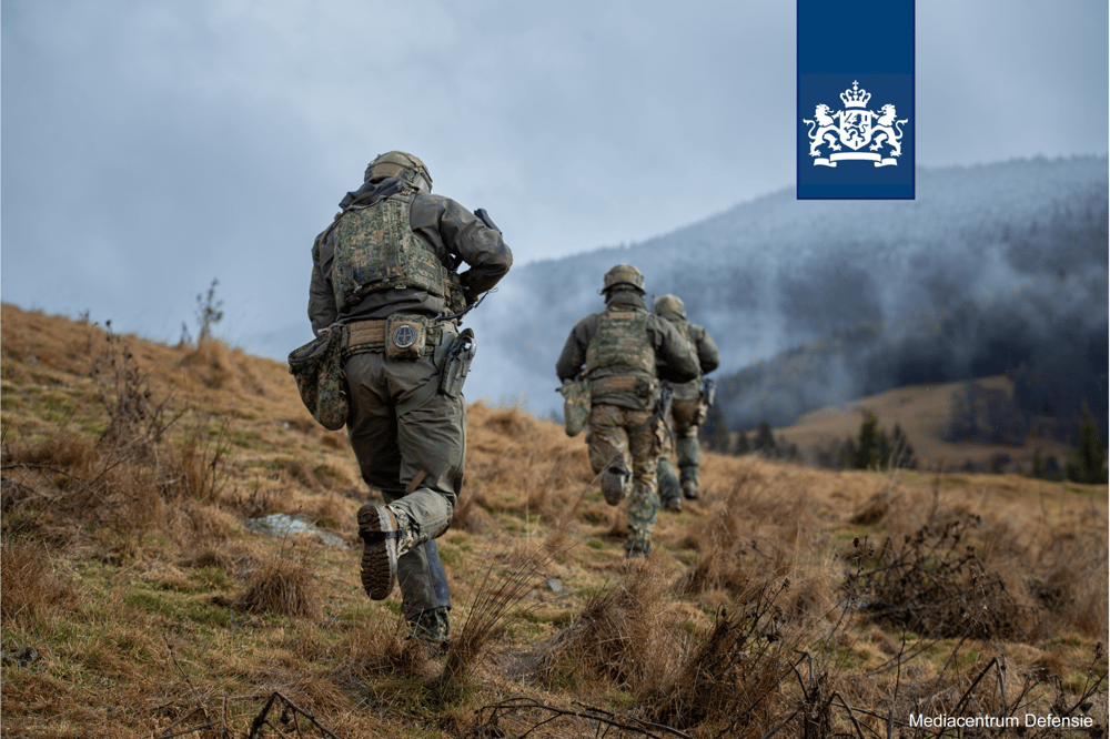 Dutch armed forces personnel on a march in the mountains