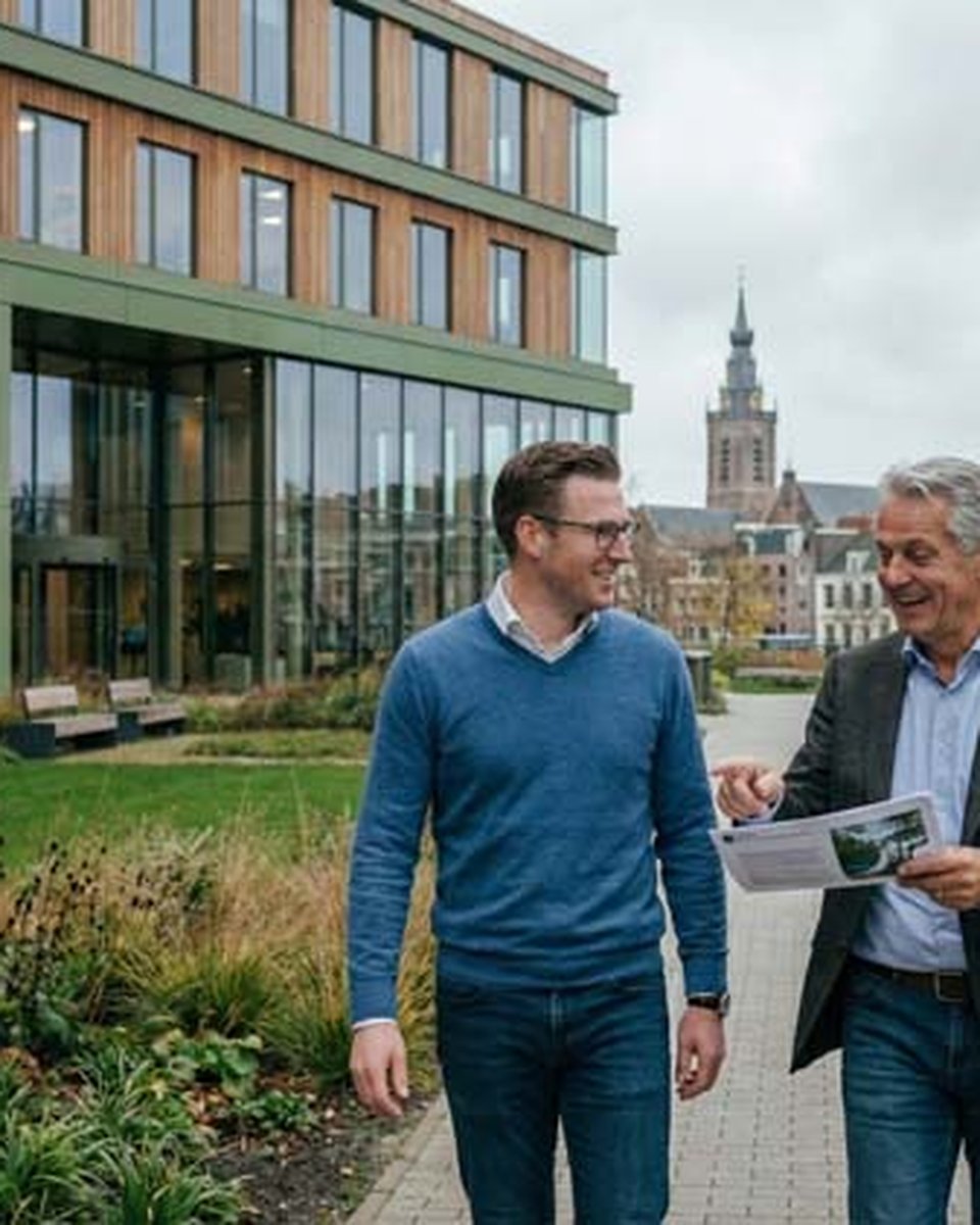 Two leaders in conversation outside the office